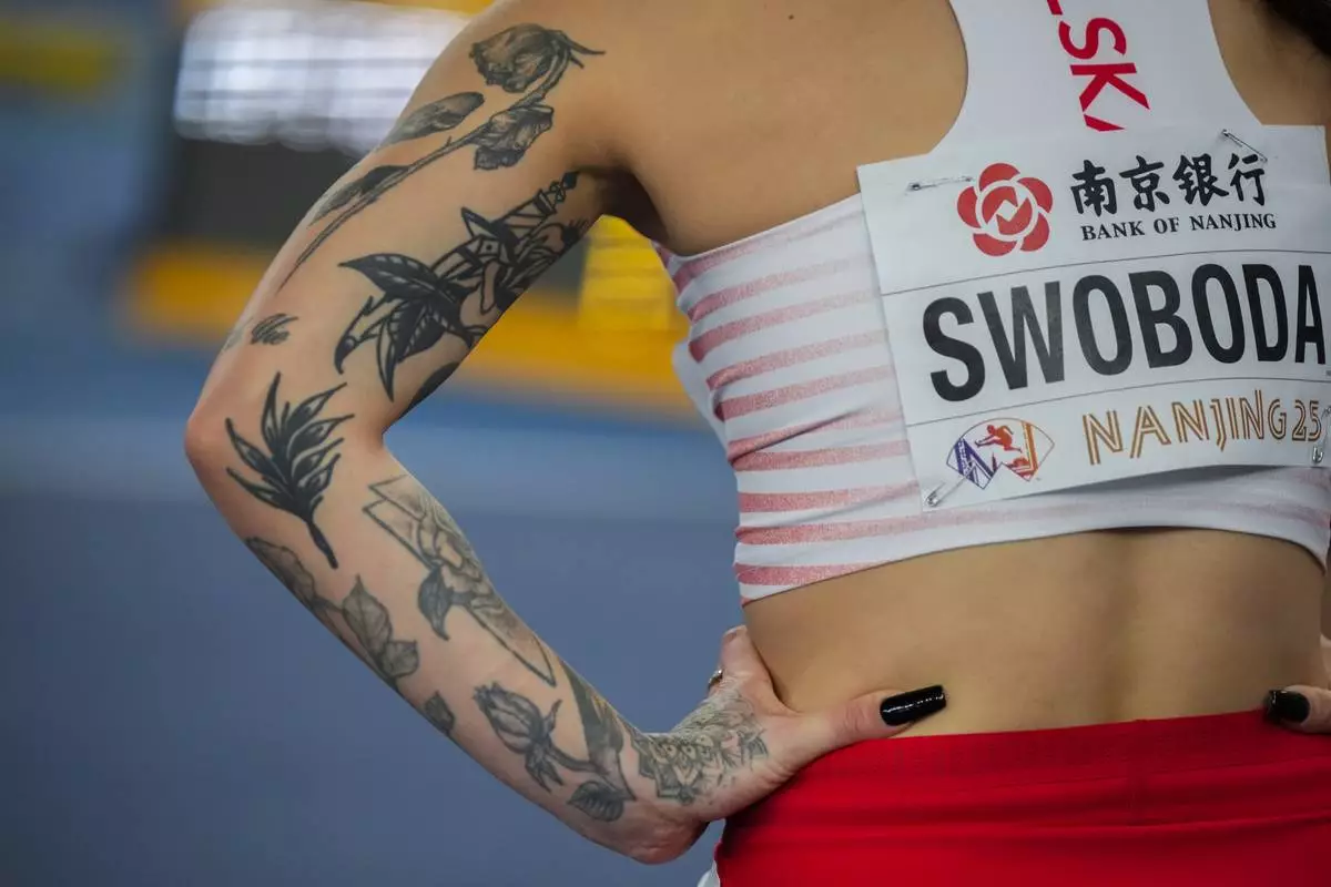 Ewa Swoboda of Poland stand after winning the women's 60 meter semifinal during the World Athletics Indoor Championships in Nanjing, China, Saturday, March 22, 2025. (AP Photo/Dar Yasin)