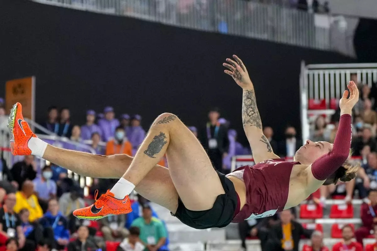 Valters Kreiss, of Latvia, makes an attempt in the men's pole vault final during the World Athletics Indoor Championships in Nanjing, China, Saturday, March 22, 2025. (AP Photo/Dar Yasin)