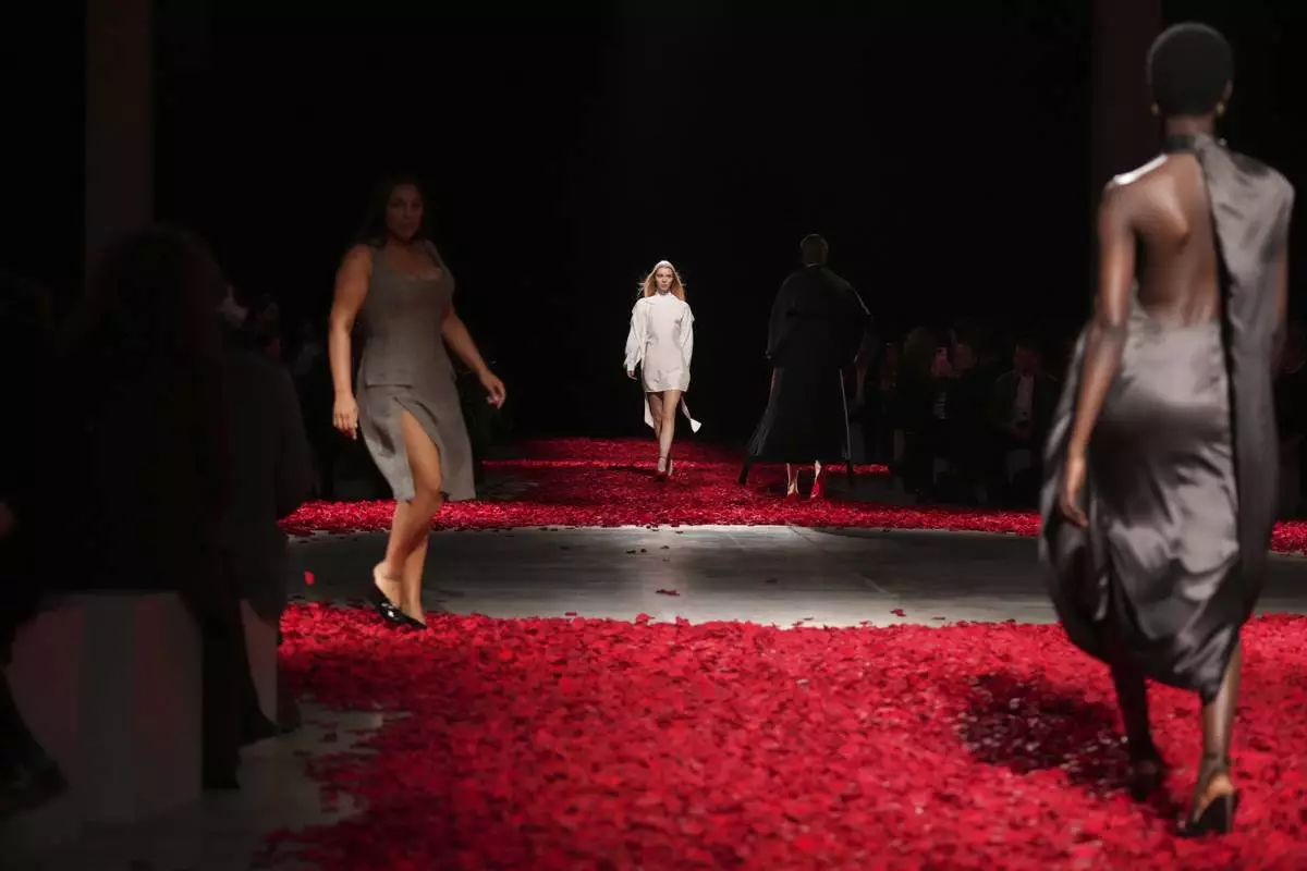 Models wear creations as part of the Ferragamo's Fall/Winter 2025-2026 collection presented in Milan, Italy, Saturday, March 1, 2025. (AP Photo/Antonio Calanni)