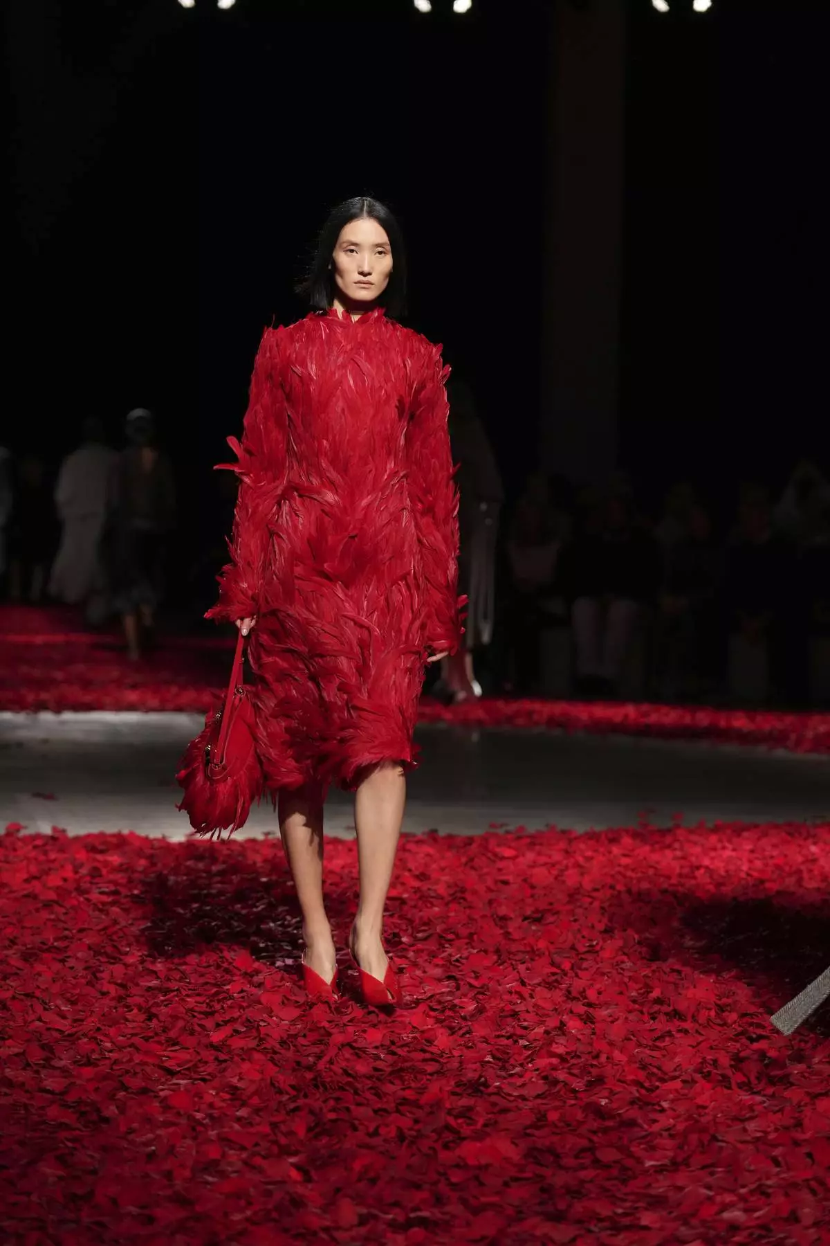 Models wear creations as part of the Ferragamo's Fall/Winter 2025-2026 collection presented in Milan, Italy, Saturday, March 1, 2025. (AP Photo/Antonio Calanni)