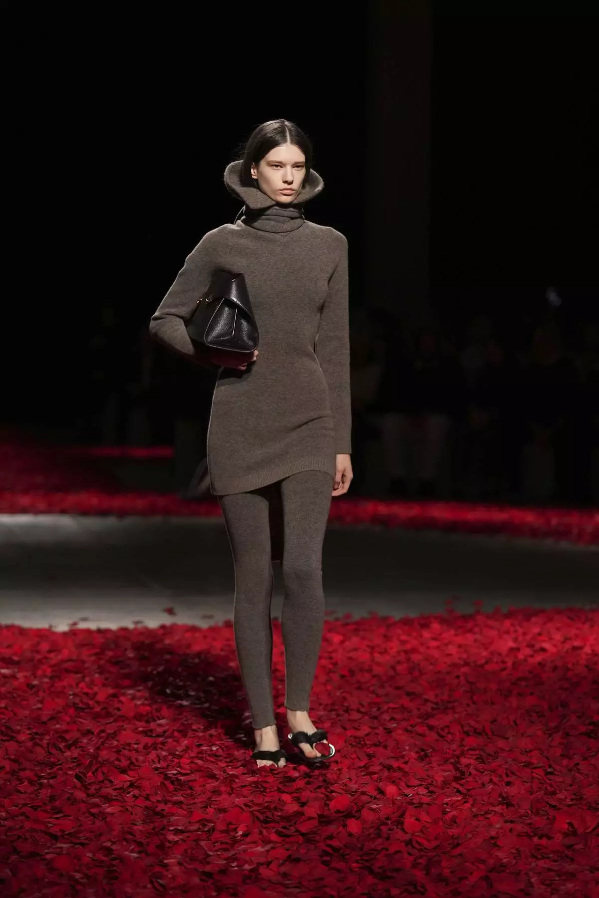 Models wear creations as part of the Ferragamo's Fall/Winter 2025-2026 collection presented in Milan, Italy, Saturday, March 1, 2025. (AP Photo/Antonio Calanni)