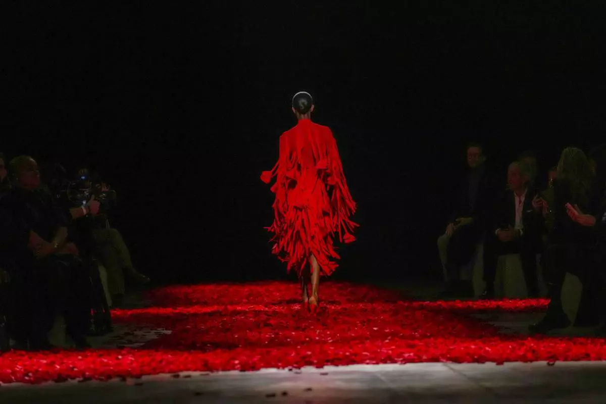 Models wear creations as part of the Ferragamo's Fall/Winter 2025-2026 collection presented in Milan, Italy, Saturday, March 1, 2025. (AP Photo/Antonio Calanni)