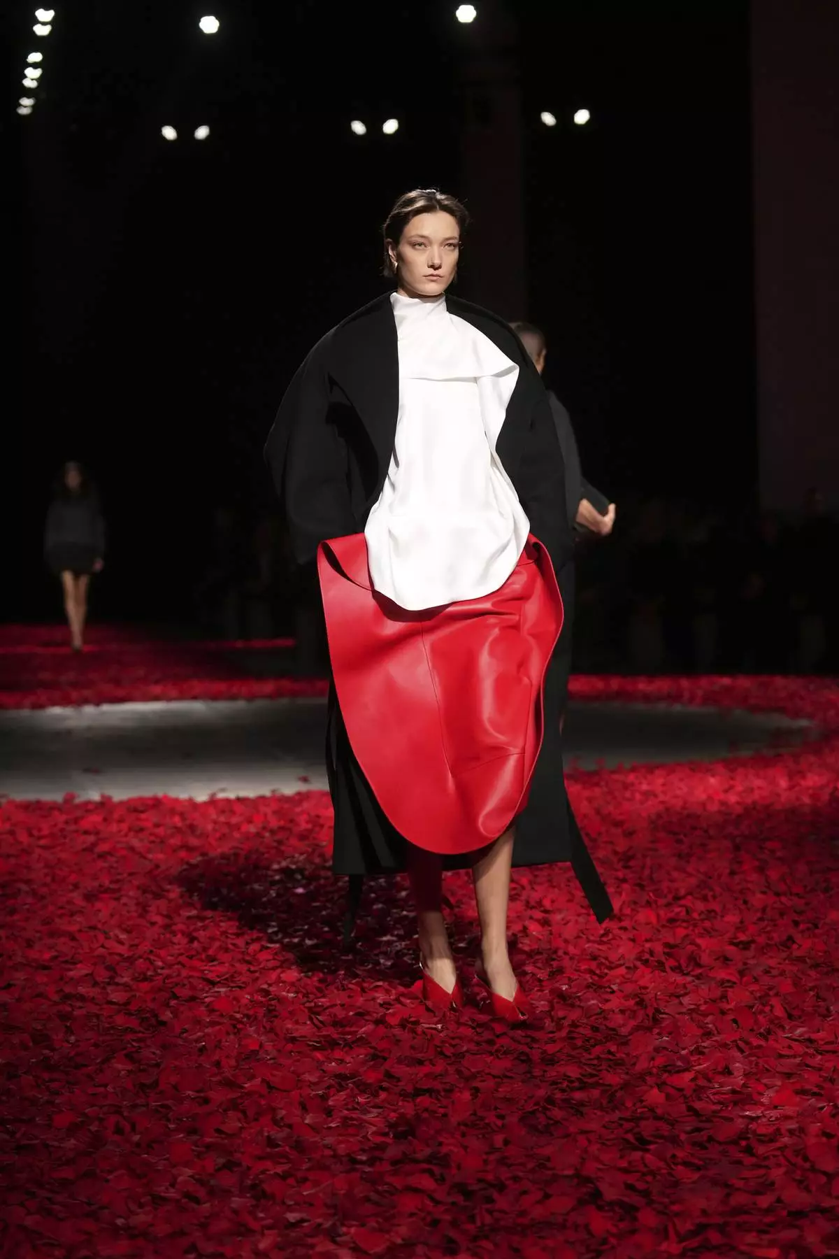 Models wear creations as part of the Ferragamo's Fall/Winter 2025-2026 collection presented in Milan, Italy, Saturday, March 1, 2025. (AP Photo/Antonio Calanni)