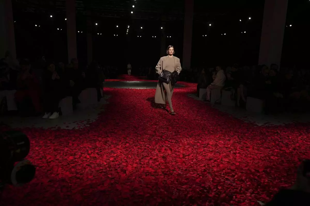 Models wear creations as part of the Ferragamo's Fall/Winter 2025-2026 Womenswear collection presented in Milan, Italy, Saturday, March 1, 2025. (AP Photo/Antonio Calanni)