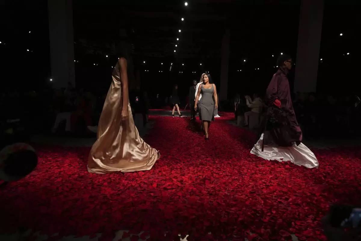 Models wear creations as part of the Ferragamo's Fall/Winter 2025-2026 collection presented in Milan, Italy, Saturday, March 1, 2025. (AP Photo/Antonio Calanni)