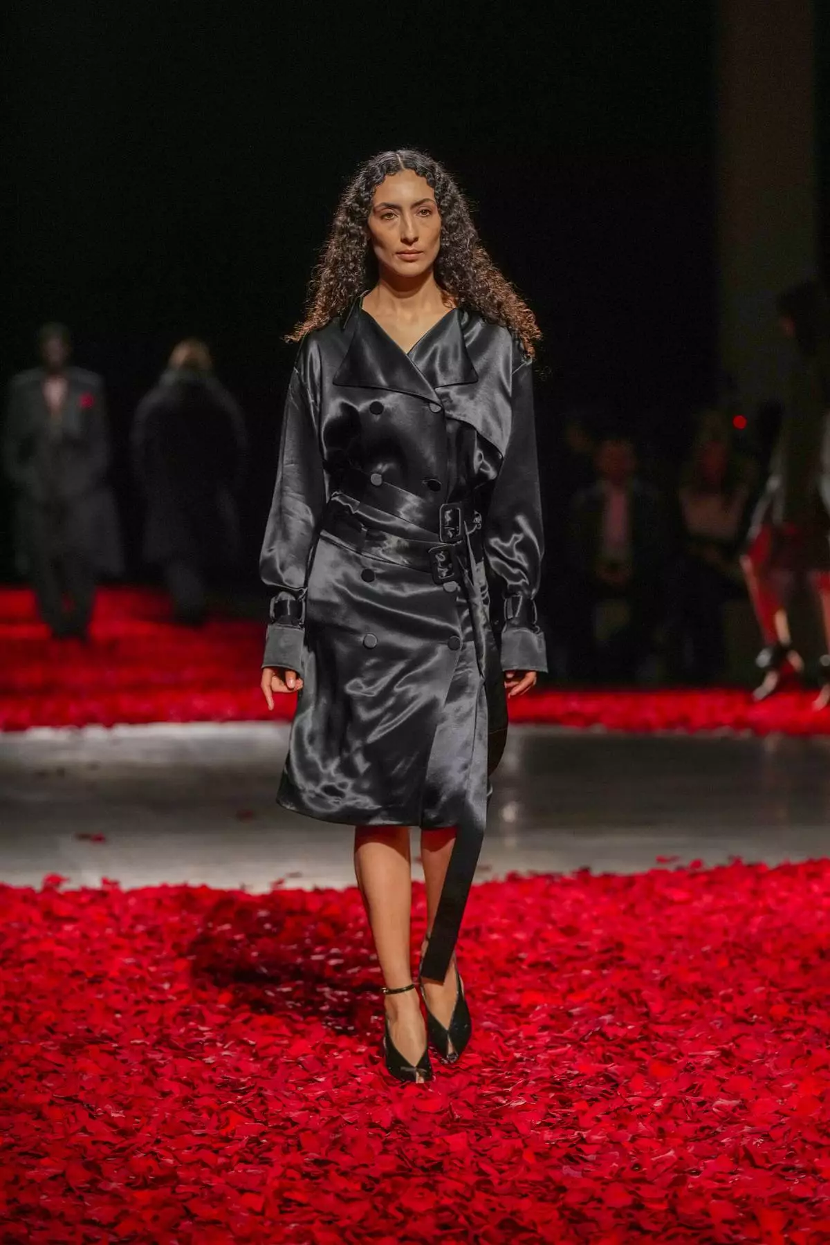 Models wear creations as part of the Ferragamo's Fall/Winter 2025-2026 collection presented in Milan, Italy, Saturday, March 1, 2025. (AP Photo/Antonio Calanni)