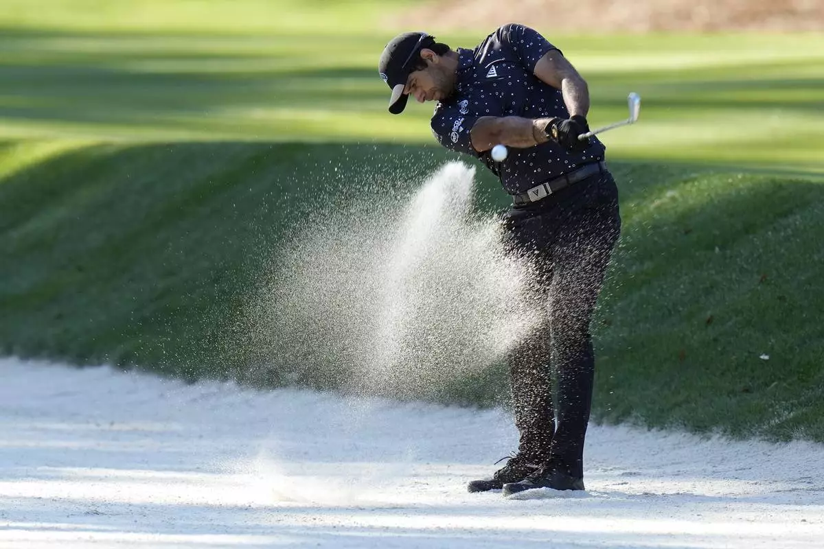 Aaron Rai, of England, hits from the sand trap on the 15th green during a practice round of The Players Championship golf tournament Wednesday, March 12, 2025, in Ponte Vedra Beach, Fla. (AP Photo/Chris O'Meara)