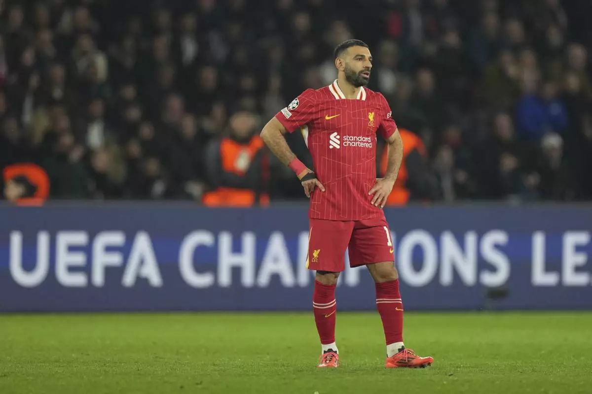 Liverpool's Mohamed Salah stands on the pitch during the Champions League round of 16 first leg soccer match between Paris Saint-Germain and Liverpool at the Parc des Princes in Paris, Wednesday, March 5, 2025. (AP Photo/Aurelien Morissard)