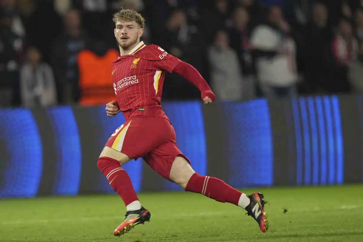 Liverpool's Harvey Elliott scores the opening goal during the Champions League round of 16 first leg soccer match between Paris Saint-Germain and Liverpool at the Parc des Princes in Paris, Wednesday, March 5, 2025. (AP Photo/Aurelien Morissard)