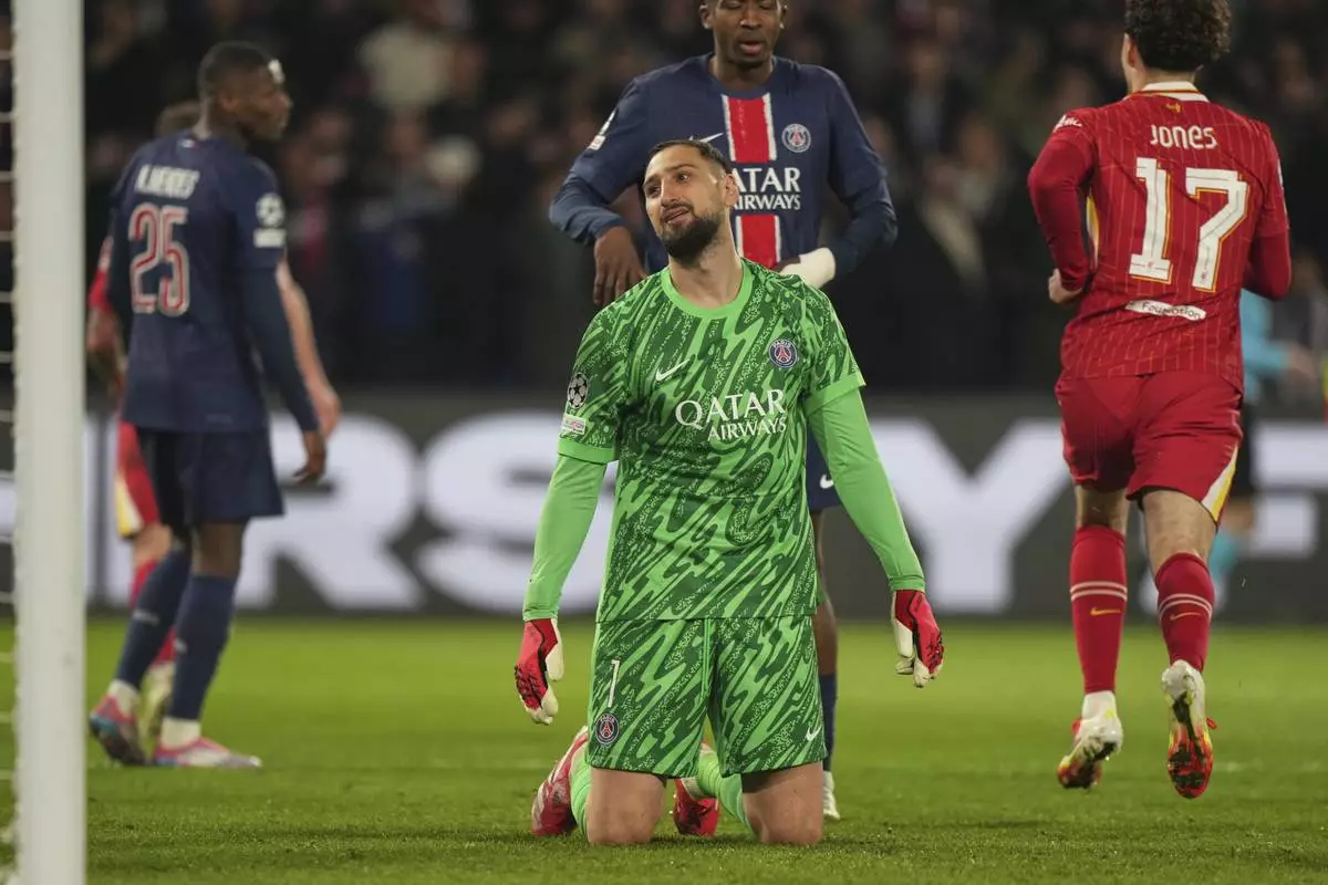 PSG's goalkeeper Gianluigi Donnarumma reacts after conceding the opening goal during the Champions League round of 16 first leg soccer match between Paris Saint-Germain and Liverpool at the Parc des Princes in Paris, Wednesday, March 5, 2025. (AP Photo/Aurelien Morissard)