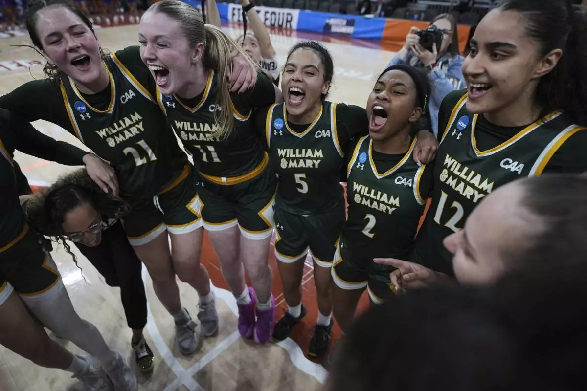 William &amp; Mary guard Bella Nascimento (5) celebrates with teammates including Natalie Fox (21), Aislinn Gibson (11), Monet Dance (2) and Jana Sallman (12) after their win over High Point in a First Four college basketball game in the NCAA Tournament in Austin, Texas, Thursday, March 20, 2025. (AP Photo/Eric Gay)