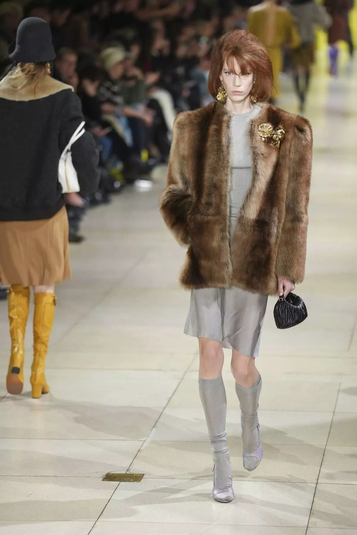 A model wears a creation as part of the Miu Miu Fall/Winter 2025-2026 Womenswear collection presented Tuesday, March 11, 2025. in Paris. (Photo by Scott A Garfitt/Invision/AP)