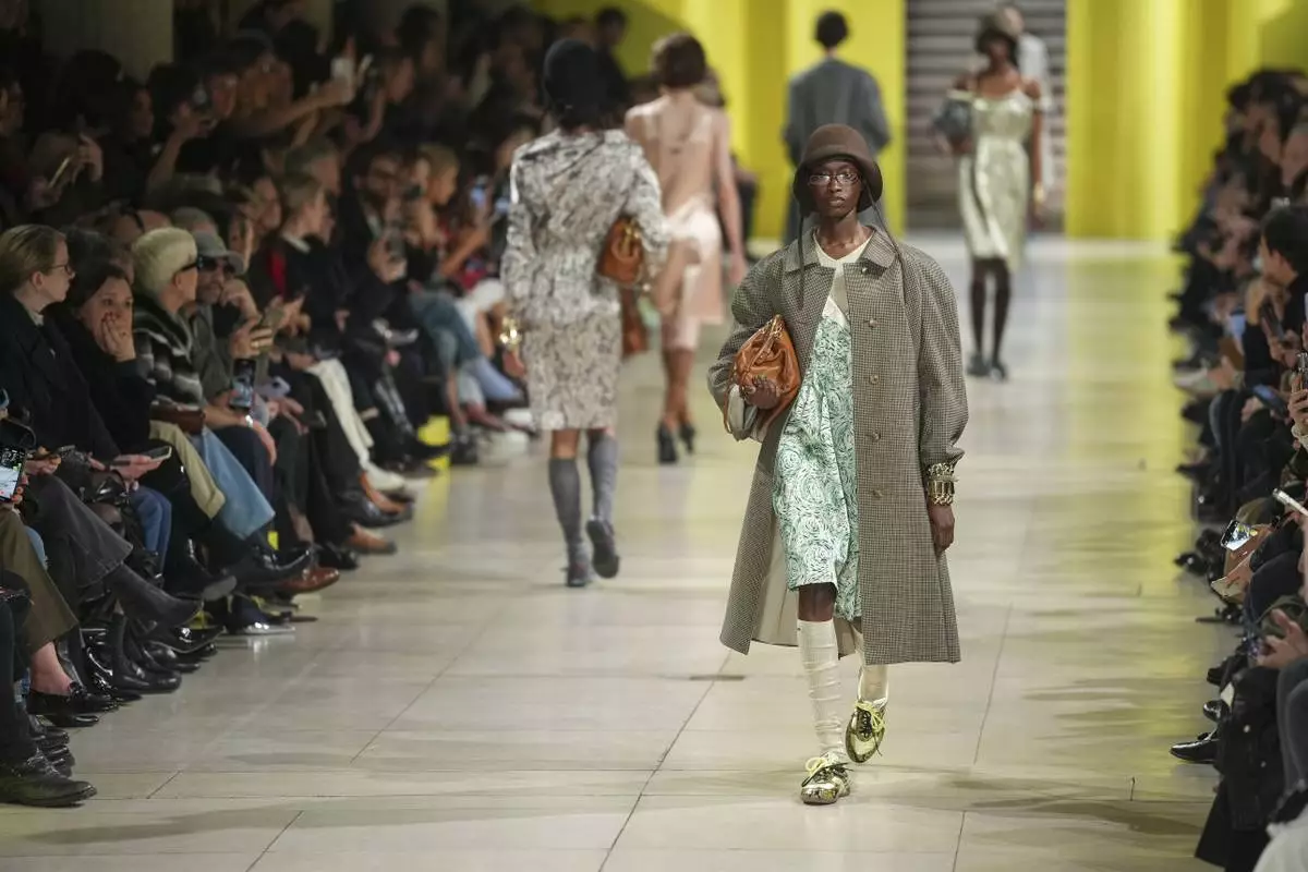 A model wears a creation as part of the Miu Miu Fall/Winter 2025-2026 Womenswear collection presented Tuesday, March 11, 2025. in Paris. (Photo by Scott A Garfitt/Invision/AP)