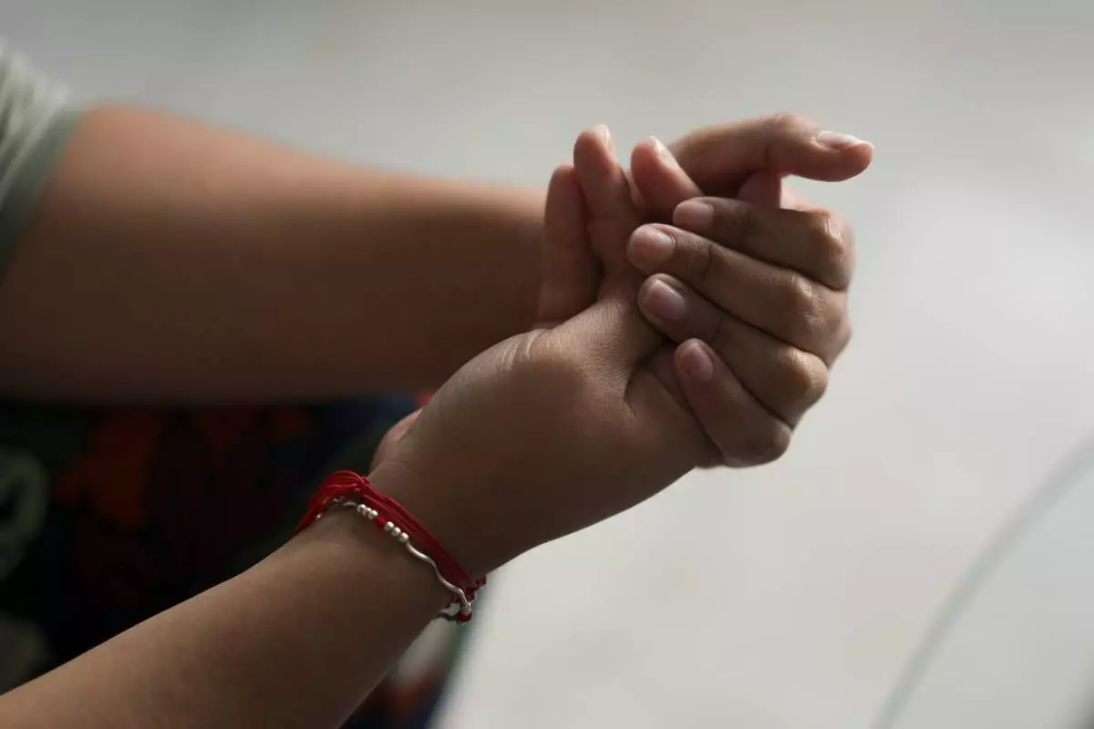 A person gives testimony at Casa Frida, a shelter that supports LGBTQ+ migrants, in Mexico City, Tuesday, Feb. 18, 2025. (AP Photo/Eduardo Verdugo)