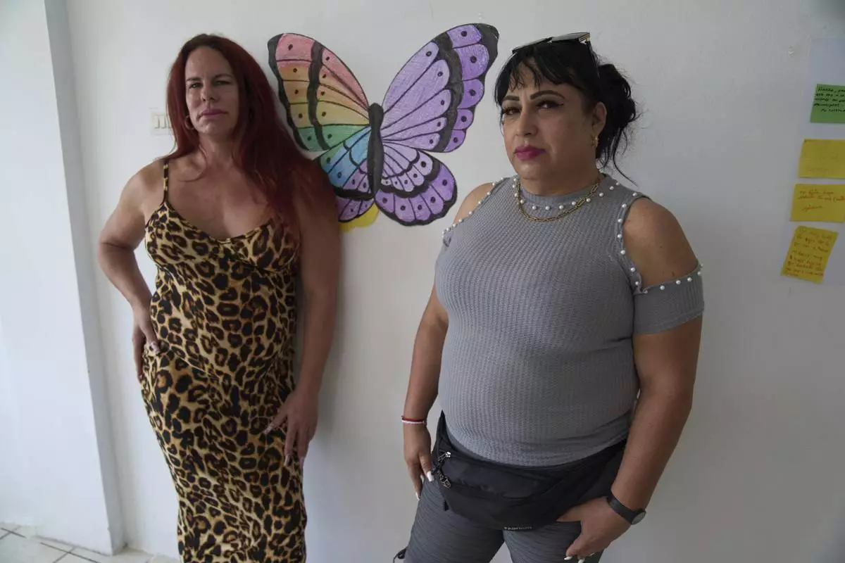 Transgender women Rachel Perez, left, and Ana Esquivel, who applied for asylum in Mexico, pose for a photo at Casa Frida, a shelter that supports LGBTQ+ migrants, in Tapachula, Chiapas state, Mexico, Tuesday, March 11, 2025. (AP Photo/Moises Castillo)