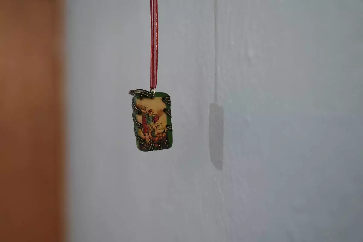 A religious image hangs in a room at Casa Frida, a shelter that supports LGBTQ+ migrants, in Mexico City, Tuesday, Feb. 18, 2025. (AP Photo/Eduardo Verdugo)