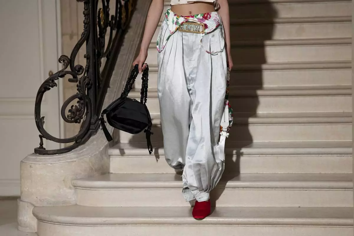 A model wears a creation as part of the Kenzo Fall/Winter 2025-2026 Womenswear collection presented in Paris, Friday, March 7, 2025. (Photo by Scott A Garfitt/Invision/AP)