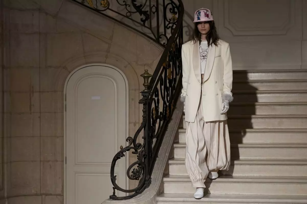 A model wears a creation as part of the Kenzo Fall/Winter 2025-2026 Womenswear collection presented in Paris, Friday, March 7, 2025. (Photo by Scott A Garfitt/Invision/AP)