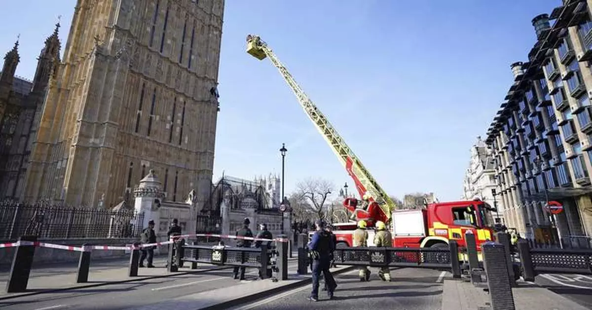 A man with a Palestinian flag climbs London's Big Ben tower and refuses to come down