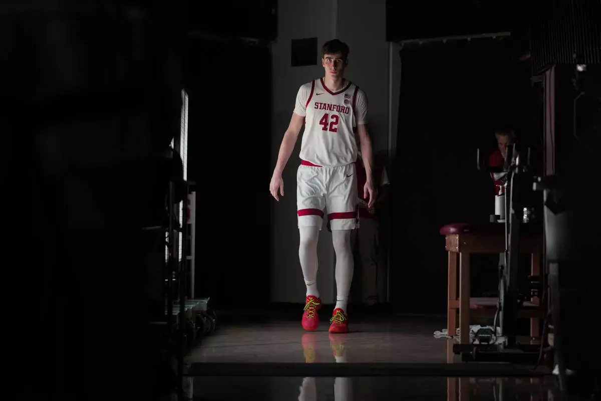 Stanford forward Maxime Raynaud (42) is introduced for the start of an NCAA college basketball game against California, Saturday, Feb. 22, 2025, in Stanford, Calif. (AP Photo/Godofredo A. Vásquez)