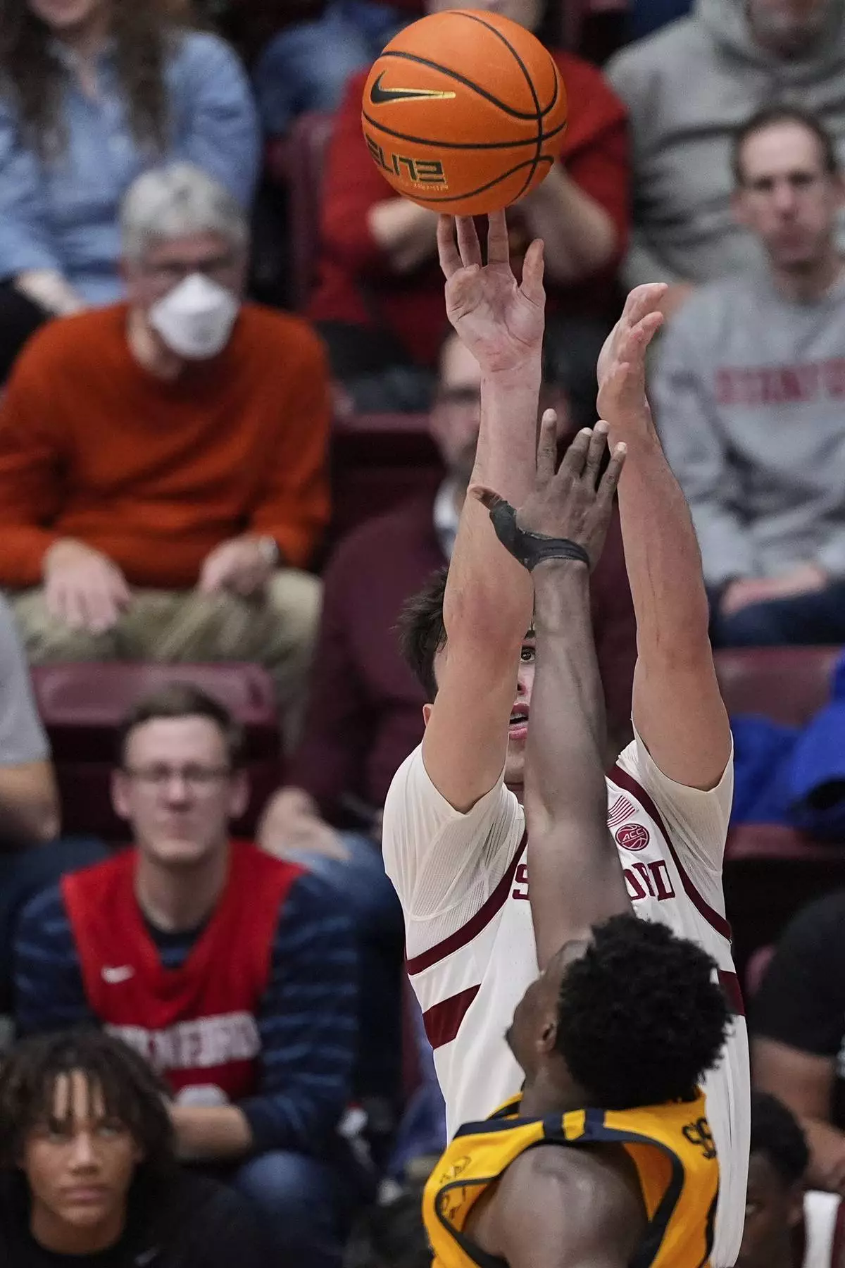 Stanford forward Maxime Raynaud, rear, shoots a 3-point basket over California center Mady Sissoko during the second half of an NCAA college basketball game Saturday, Feb. 22, 2025, in Stanford, Calif. (AP Photo/Godofredo A. Vásquez)
