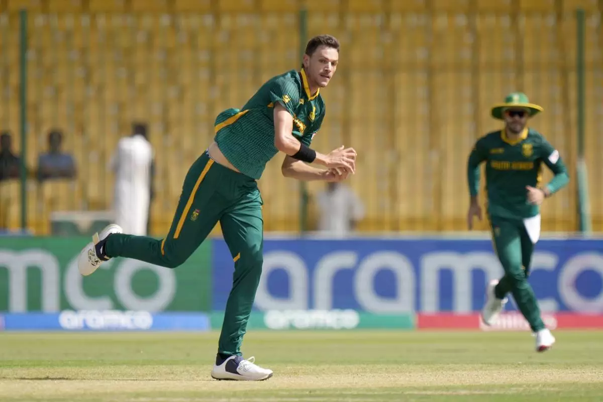 South Africa's Marco Jansen, center, takes the catch of England's Ben Duckett during the ICC Champions Trophy cricket match between England and South Africa, in Karachi, Pakistan Saturday, March 1, 2025. (AP Photo/Anjum Naveed)