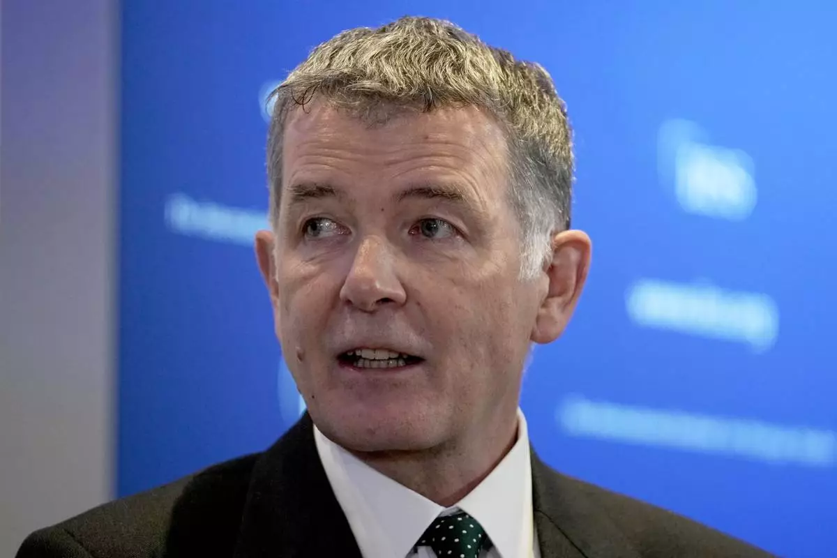 FILE - Richard Moore, the Chief of Britain's Secret Intelligence Service, also known as MI6, answers questions in London, England, Nov. 30, 2021, after giving his first public speech since becoming head of the organization. (AP Photo/Matt Dunham, File)