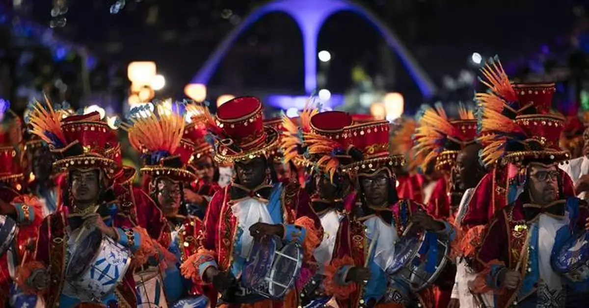 With flicks of the wrist, Rio Carnival's drum maestros keep everyone locked in on the beat