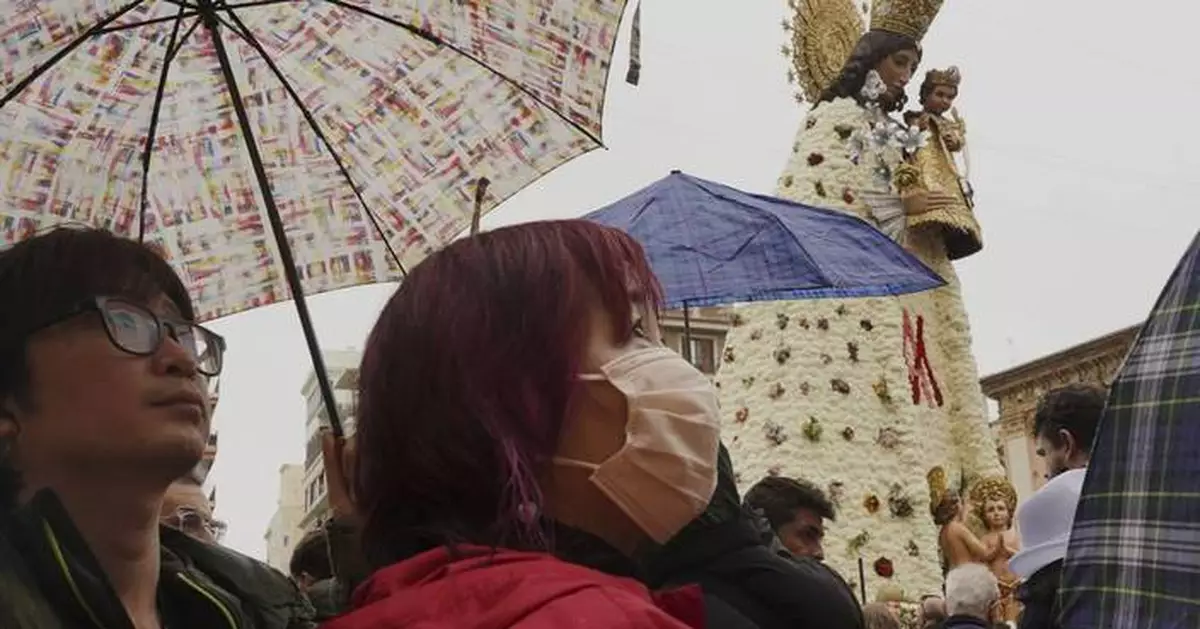 Valencia seeks catharsis in traditional burning of sculptures months after deadly floods