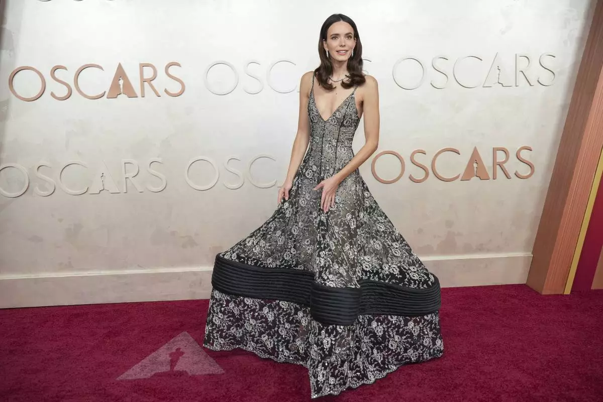 CORRECTS NAME-Stacy Martin arrives at the Oscars on Sunday, March 2, 2025, at the Dolby Theatre in Los Angeles. (AP Photo/Jae C. Hong)