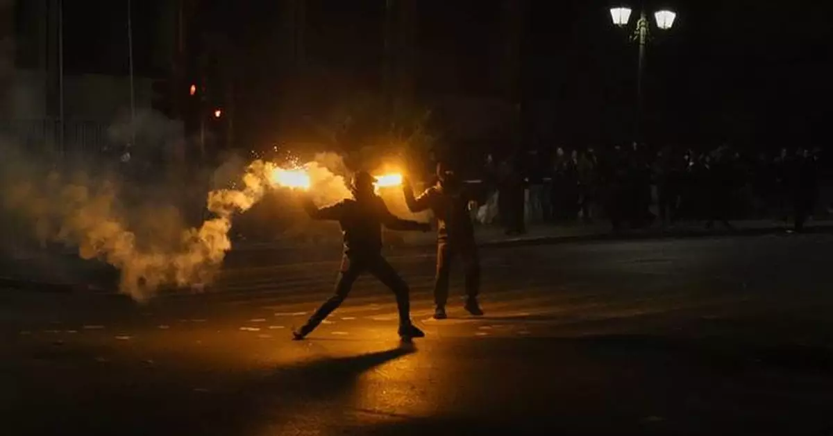 Violence erupts during protests in Greece as government challenged in vote over rail disaster