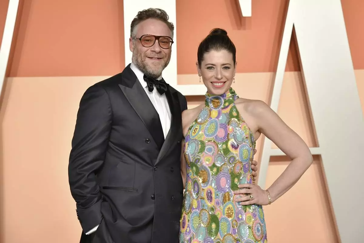 Seth Rogen and Lauren Miller Rogen arrive at the Vanity Fair Oscar Party on Sunday, March 2, 2025, at the Wallis Annenberg Center for the Performing Arts in Beverly Hills, Calif. (Photo by Evan Agostini/Invision/AP)