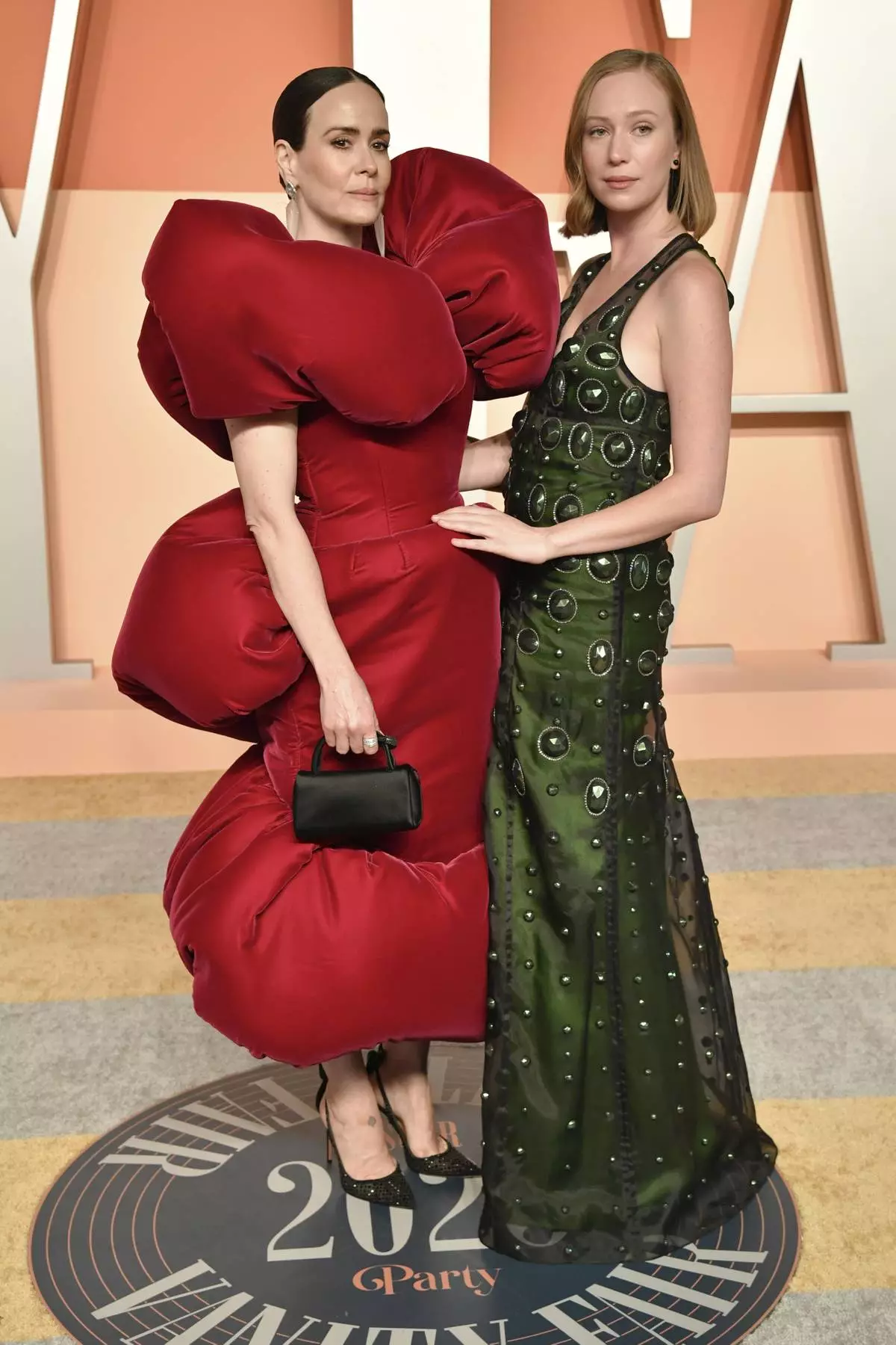 Sarah Paulson and Hannah Einbinder arrive at the Vanity Fair Oscar Party on Sunday, March 2, 2025, at the Wallis Annenberg Center for the Performing Arts in Beverly Hills, Calif. (Photo by Evan Agostini/Invision/AP)