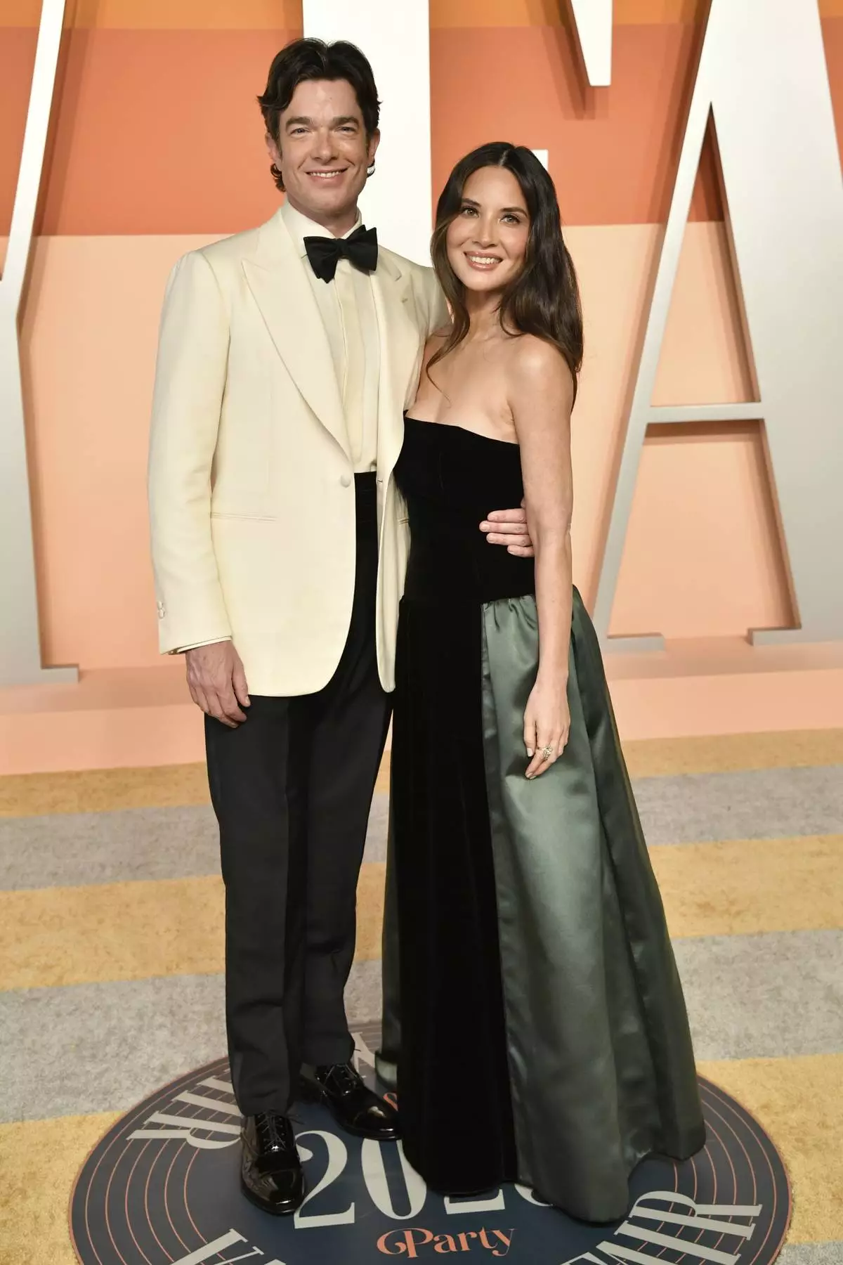 John Mulaney and Olivia Munn arrive at the Vanity Fair Oscar Party on Sunday, March 2, 2025, at the Wallis Annenberg Center for the Performing Arts in Beverly Hills, Calif. (Photo by Evan Agostini/Invision/AP)