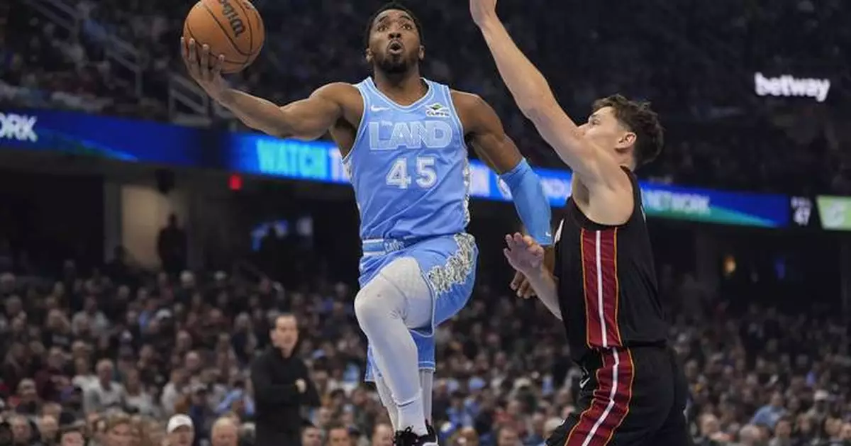 Cavaliers hold off Heat 112-107 to extend winning streak to 12 and clinch playoff spot