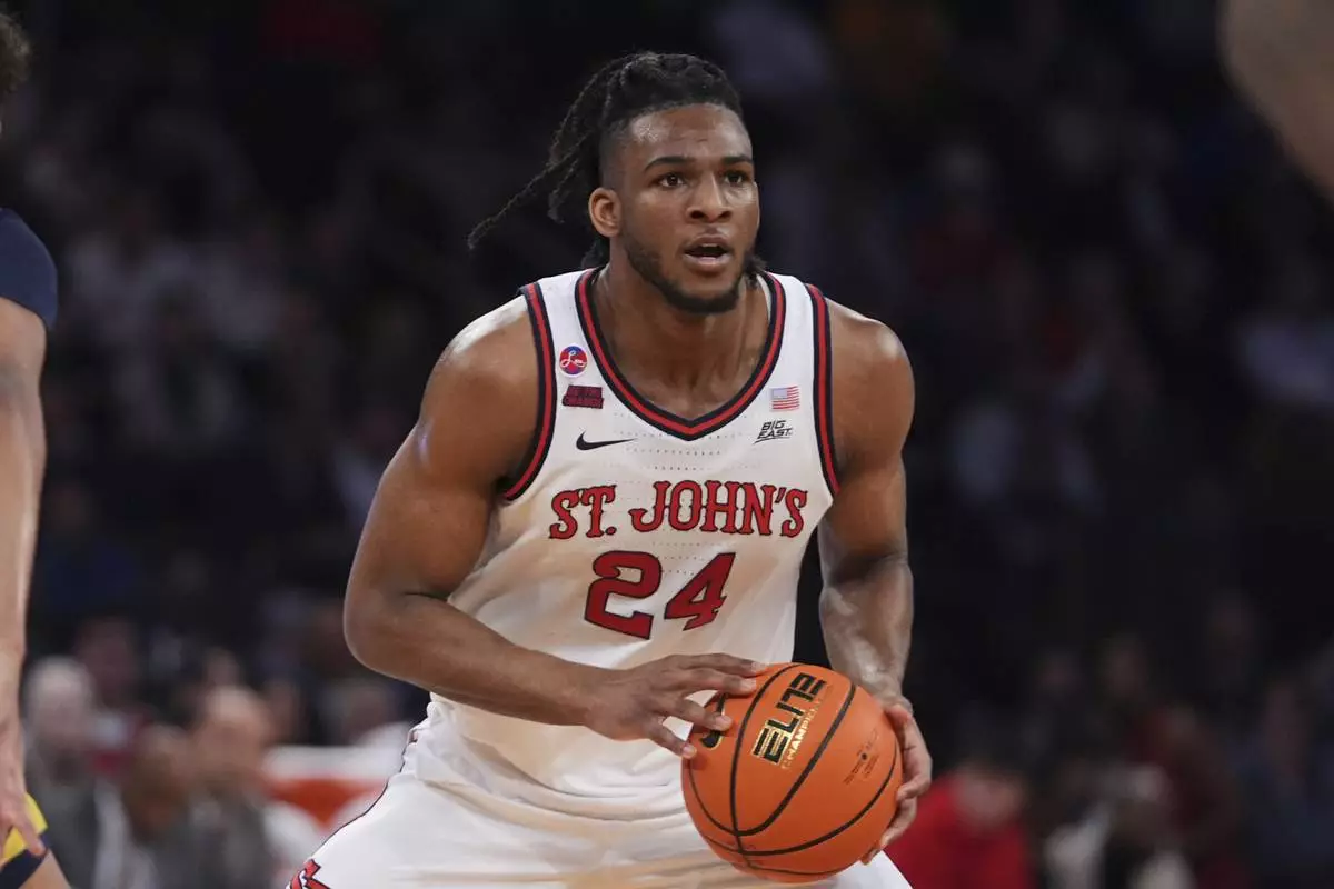 St. John's's Zuby Ejiofor (24) looks to pass during the first half of an NCAA college basketball game against the Marquette in the semifinals of the Big East tournament Friday, March 14, 2025, in New York. (AP Photo/Frank Franklin II)