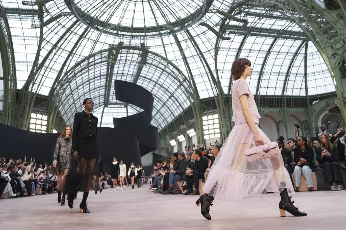 Models wear creations as part of the Chanel Fall/Winter 2025-2026 Womenswear collection presented Tuesday, March 11, 2025. in Paris. (Photo by Scott A Garfitt/Invision/AP)