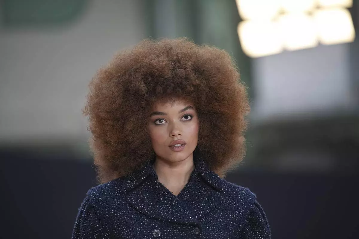 Whitney Peak arrives for the the Chanel Fall/Winter 2025-2026 Womenswear collection presented Tuesday, March 11, 2025. in Paris. (AP Photo/Christophe Ena).