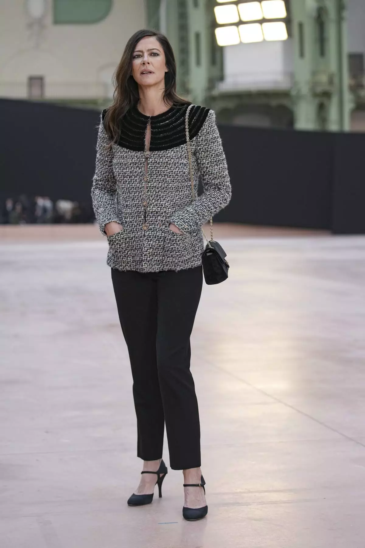 Anna Mouglalis arrives for the the Chanel Fall/Winter 2025-2026 Womenswear collection presented Tuesday, March 11, 2025. in Paris. (AP Photo/Christophe Ena).