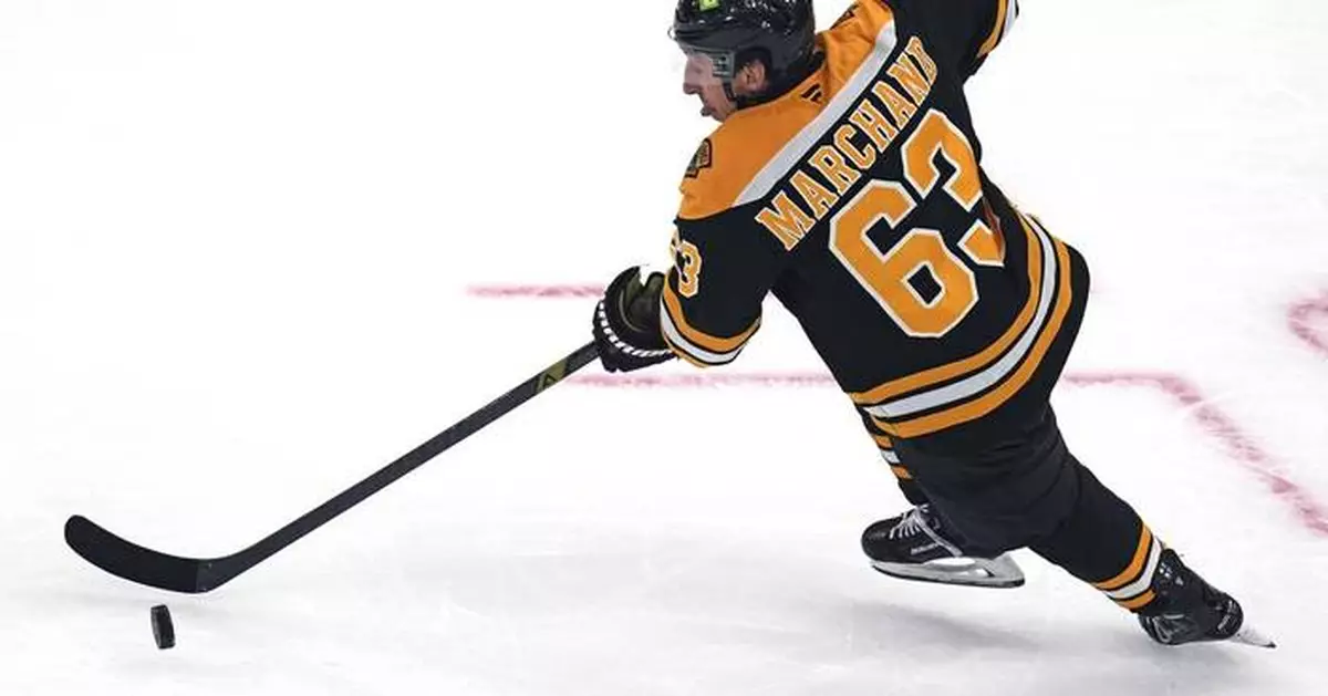 Bruins captain Brad Marchand departs with upper-body injury