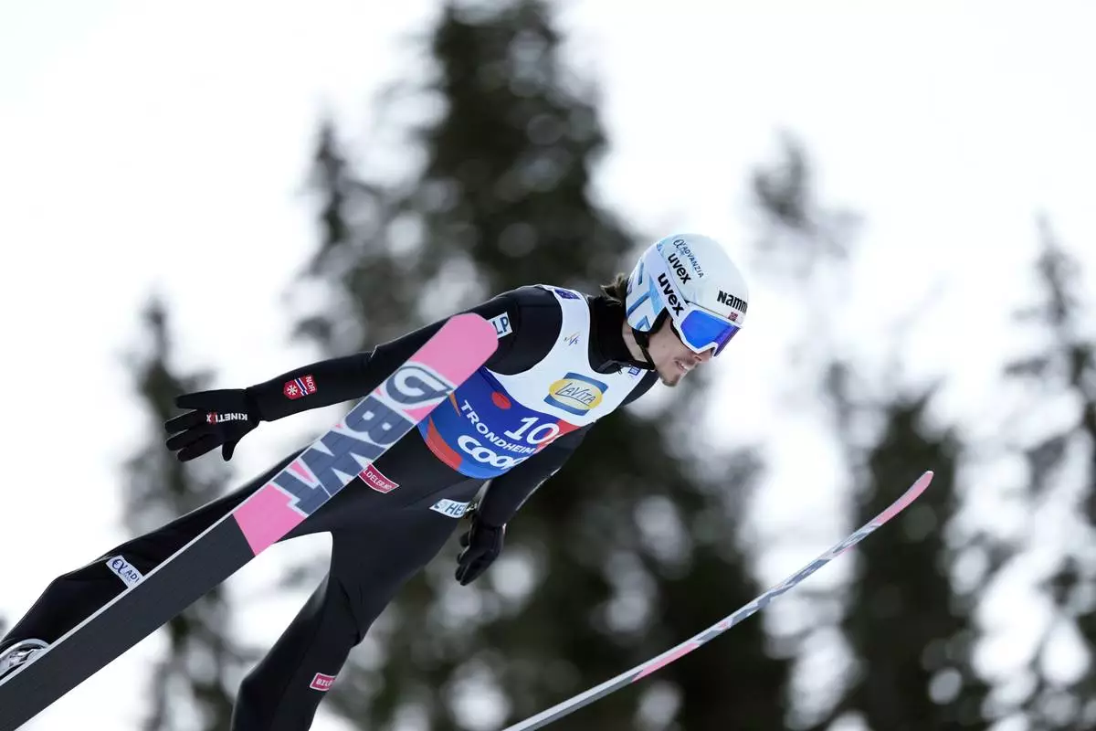 Johann Andre Forfang, of Norway, soars through the air during his first round jump of the ski jumping men's team large hill competition at the Nordic World Ski Championships in Trondheim, Norway, Thursday, March 6, 2025. (AP Photo/Matthias Schrader)