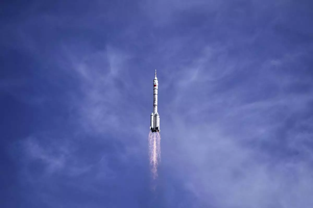 China's Long March 2F rocket, carrying three astronauts for the Shenzhou 20 manned space mission, lifts off for a space station, at the Jiuquan Satellite Launch Center in Jiuquan, northwestern China, Thursday, April 24, 2025. (AP Photo/Andy Wong)