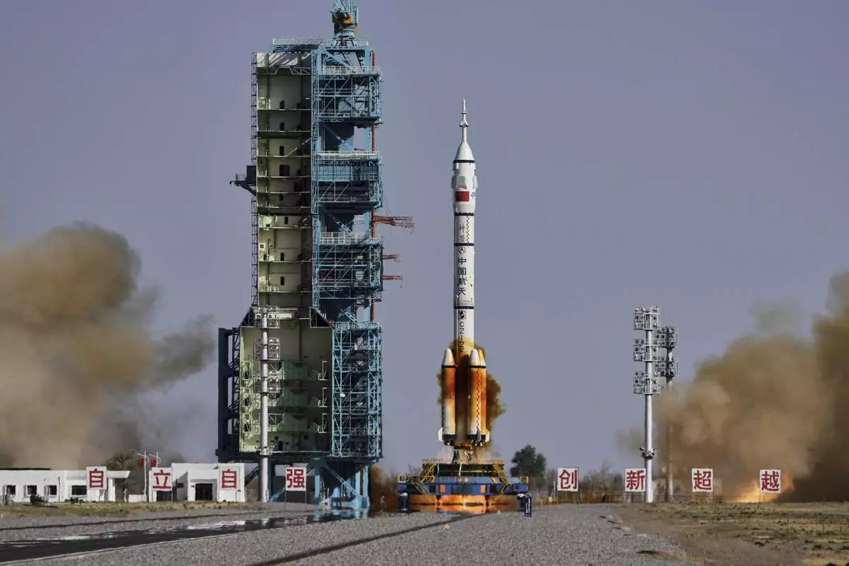 China's Long March 2F rocket, carrying three astronauts for the Shenzhou 20 manned space mission, blasts off at the Jiuquan Satellite Launch Center in Jiuquan, northwestern China, Thursday, April 24, 2025. (AP Photo/Andy Wong)