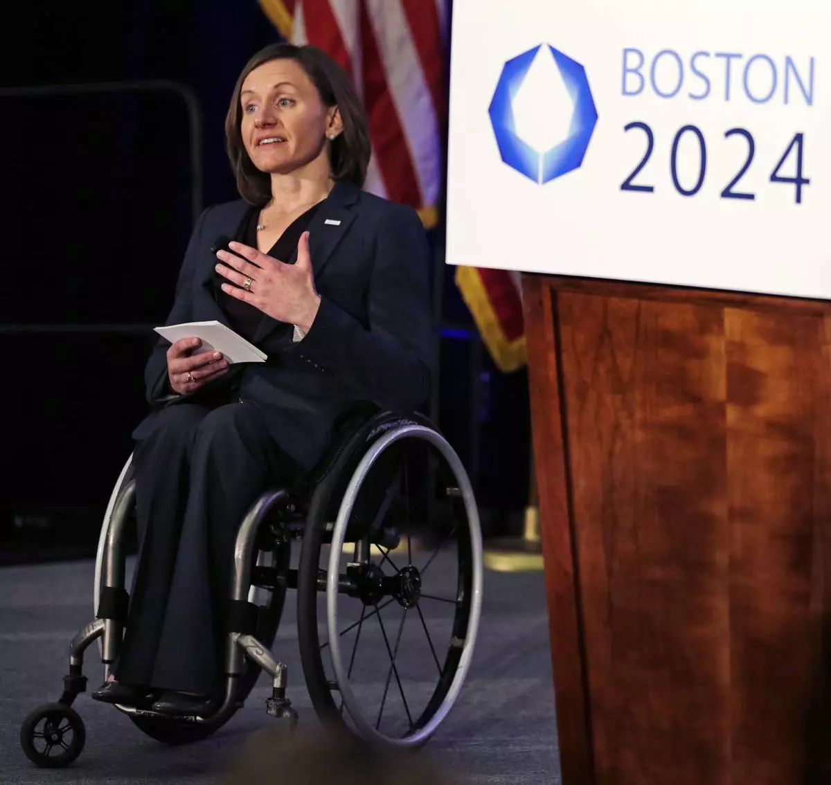 FILE - Cheri Blauwet, co-chair of the Boston 2024 Olympic and Paralympic Movement Committee, addresses reporters during a news conference by organizers of Boston's campaign for the 2024 Summer Olympics in Boston, Jan. 21, 2015. (AP Photo/Charles Krupa, File)