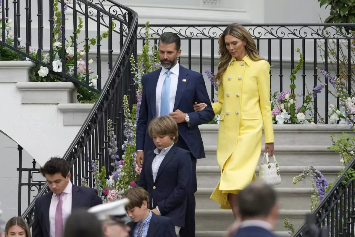 Donald Trump Jr., and his girlfriend Bettina Anderson arrive for the White House Easter Egg Roll on the South Lawn of the White House, Monday, April 21, 2025, in Washington. (AP Photo/Alex Brandon)