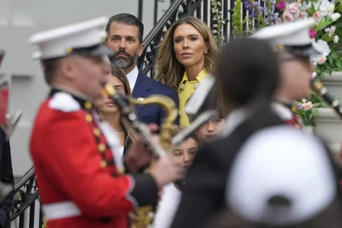 Donald Trump Jr., and his girlfriend Bettina Anderson arrive for the White House Easter Egg Roll on the South Lawn of the White House, Monday, April 21, 2025, in Washington. (AP Photo/Alex Brandon)