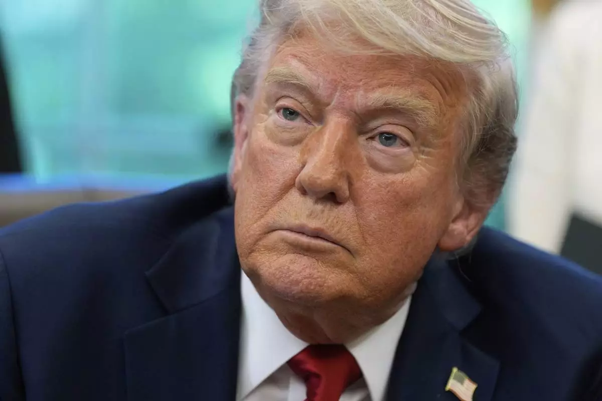 President Donald Trump speaks with reporters after signing executive orders in the Oval Office of the White House, Wednesday, April 23, 2025, in Washington. (AP Photo/Alex Brandon)