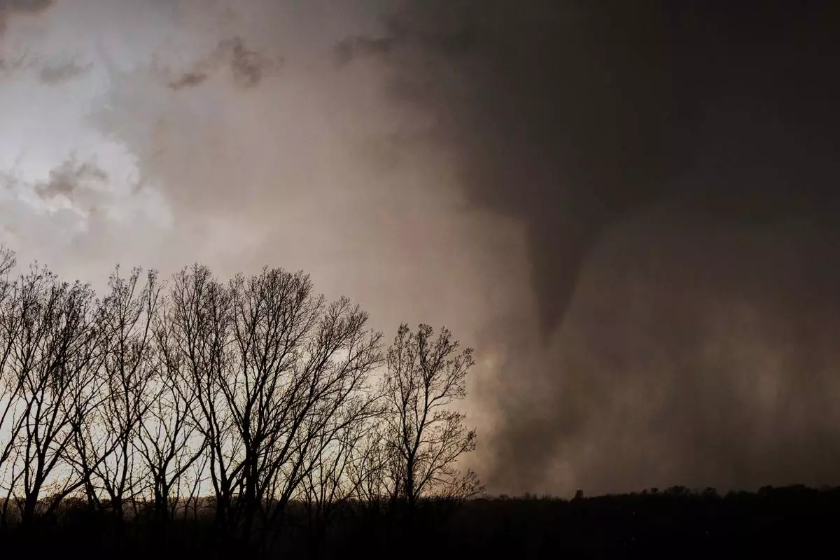 A tornados is seen just north of Omaha, Neb. from Highway 75 , on Thursday, April 17, 2025. (Chris Machian/Omaha World-Herald via AP)