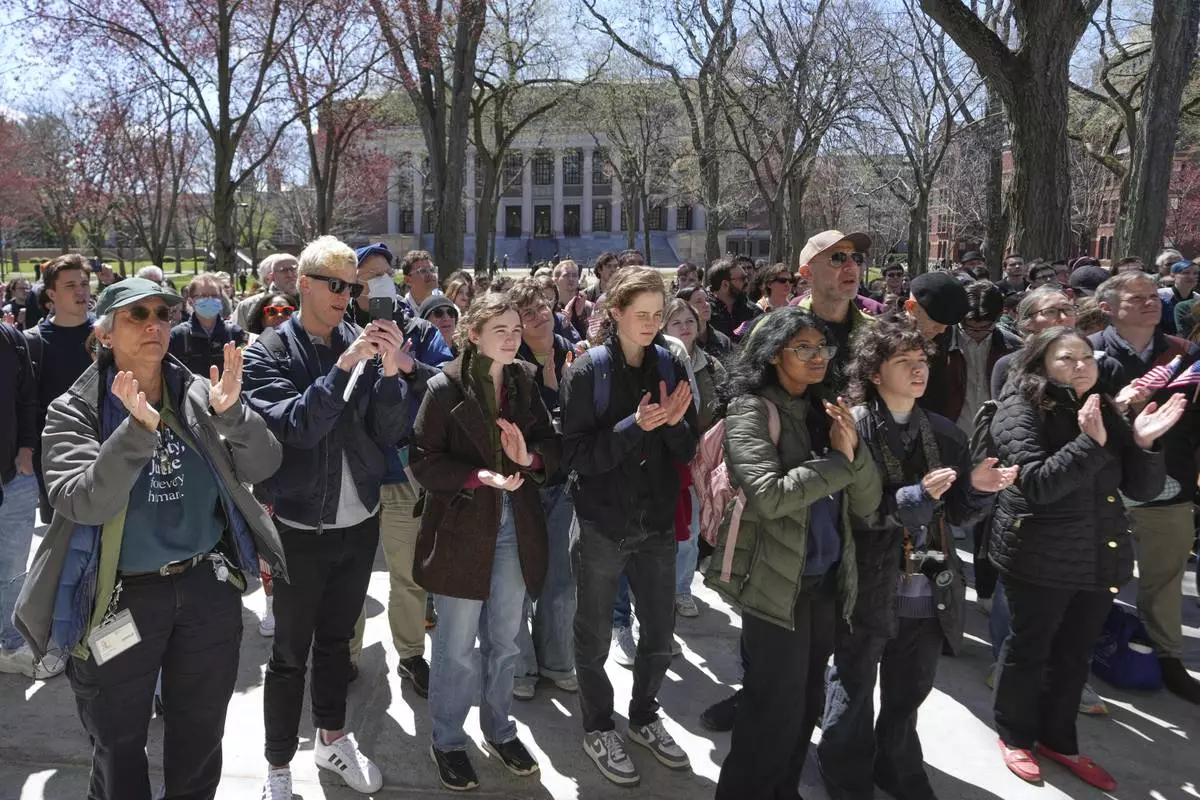 Students, faculty and members of the Harvard University community rally, Thursday, April 17, 2025, in Cambridge, Mass. (AP Photo/Charles Krupa)