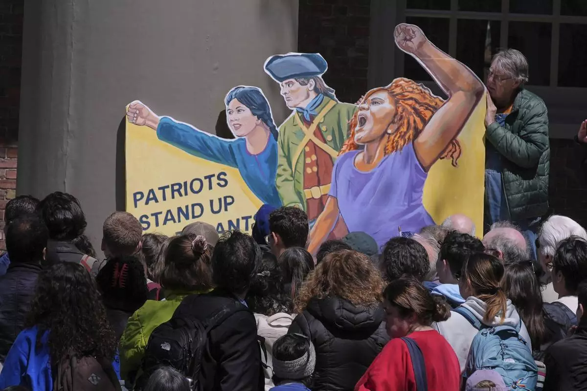 Students, faculty and members of the Harvard University community rally, Thursday, April 17, 2025, in Cambridge, Mass. (AP Photo/Charles Krupa)